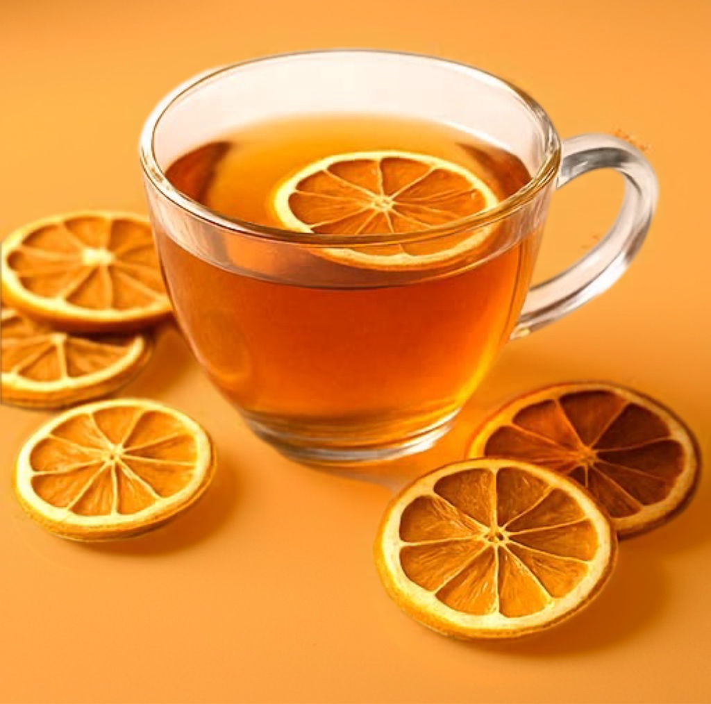 Image of Glass Mug of Tea with Dehydrated Orange Slices